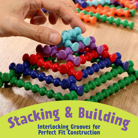 Popular Playthings Playstix color coding guides planning and size comparison during building.