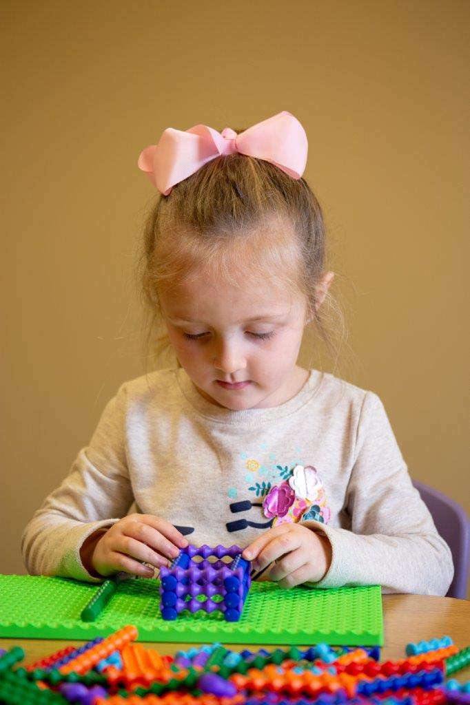 Popular Playthings Playstix interlocking grooves enable secure connections during kid-friendly construction