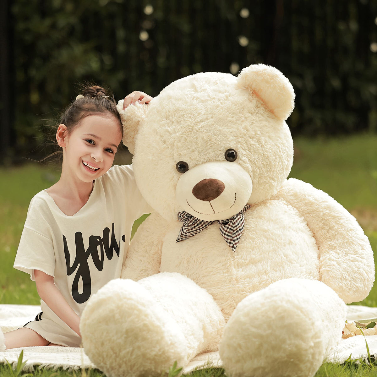 Poutmac teddy bear in bedroom decor, cozy display