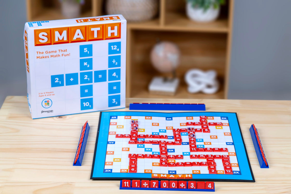 Pressman Smath players in action forming math equations on the board.