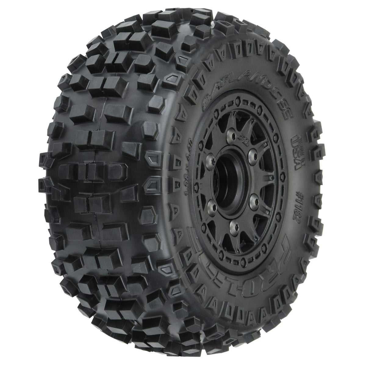 Pro-Line Badlands SC tire close-up with motocross tread for off-road grip.