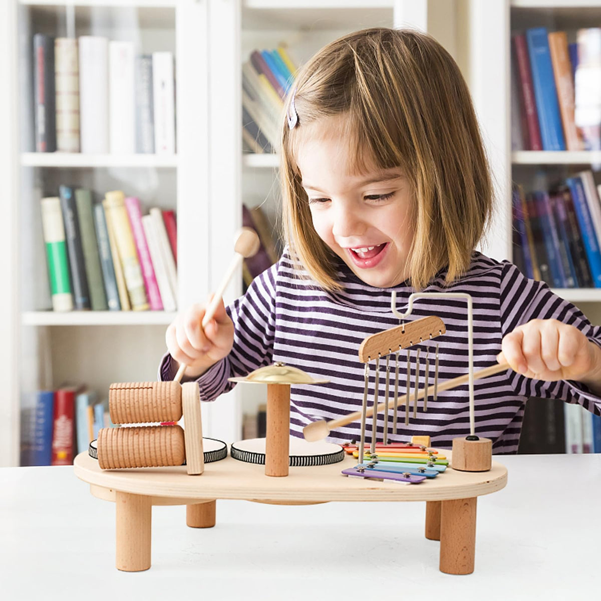 Promise Babe wooden drum set hand-eye motor skills development photo shows active play.