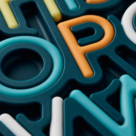 Pushpeel patented design closeup reveals a unique hands-on alphabet learning experience.