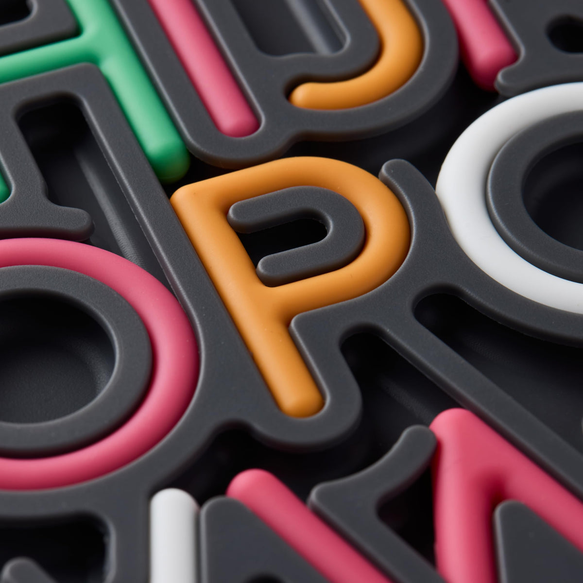 Pushpeel Patented Design feature showcasing unique tactile alphabet experience.