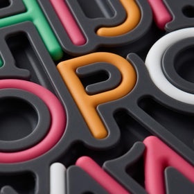 Pushpeel Patented Design feature showcasing unique tactile alphabet experience.