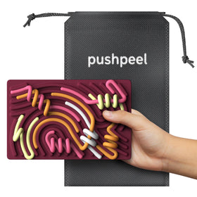 Pushpeel Sensory Board on desk supports stress relief and quiet time.