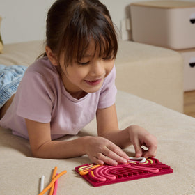 Pushpeel sensory board strings close-up for tactile fidget use.
