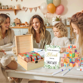 Guests decorating Pydeeirom blocks at a baby shower