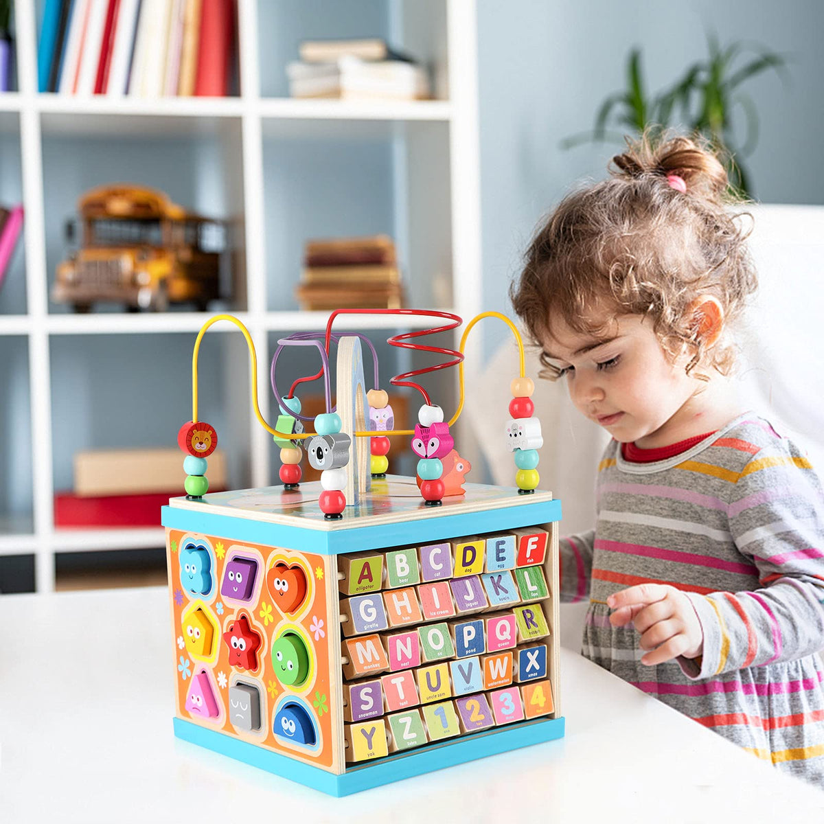 Qilay 5-in-1 wooden activity cube side view shows sturdy pine wood and safe, rounded edges.