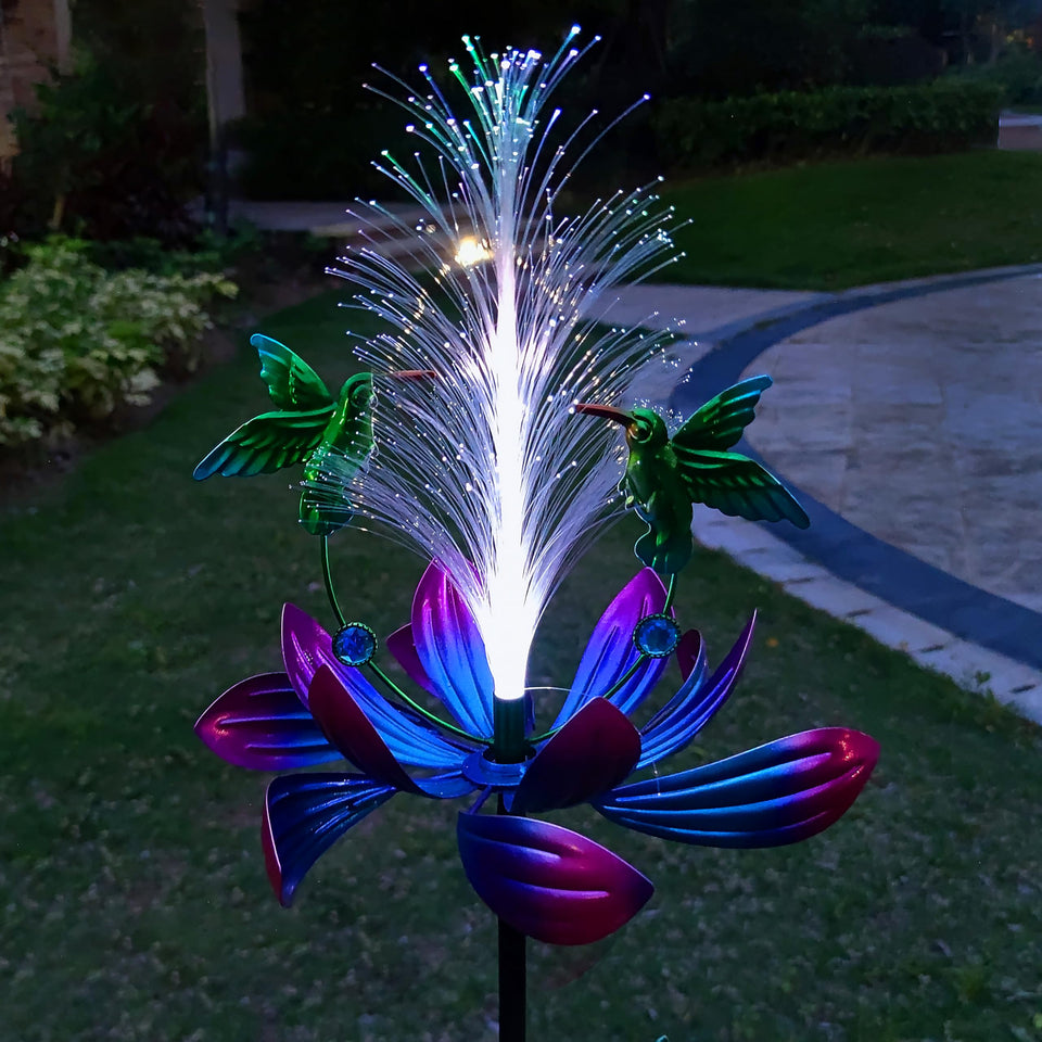 Qobumy solar hummingbird wind spinner closeup highlighting rotating petals for dynamic garden motion.
