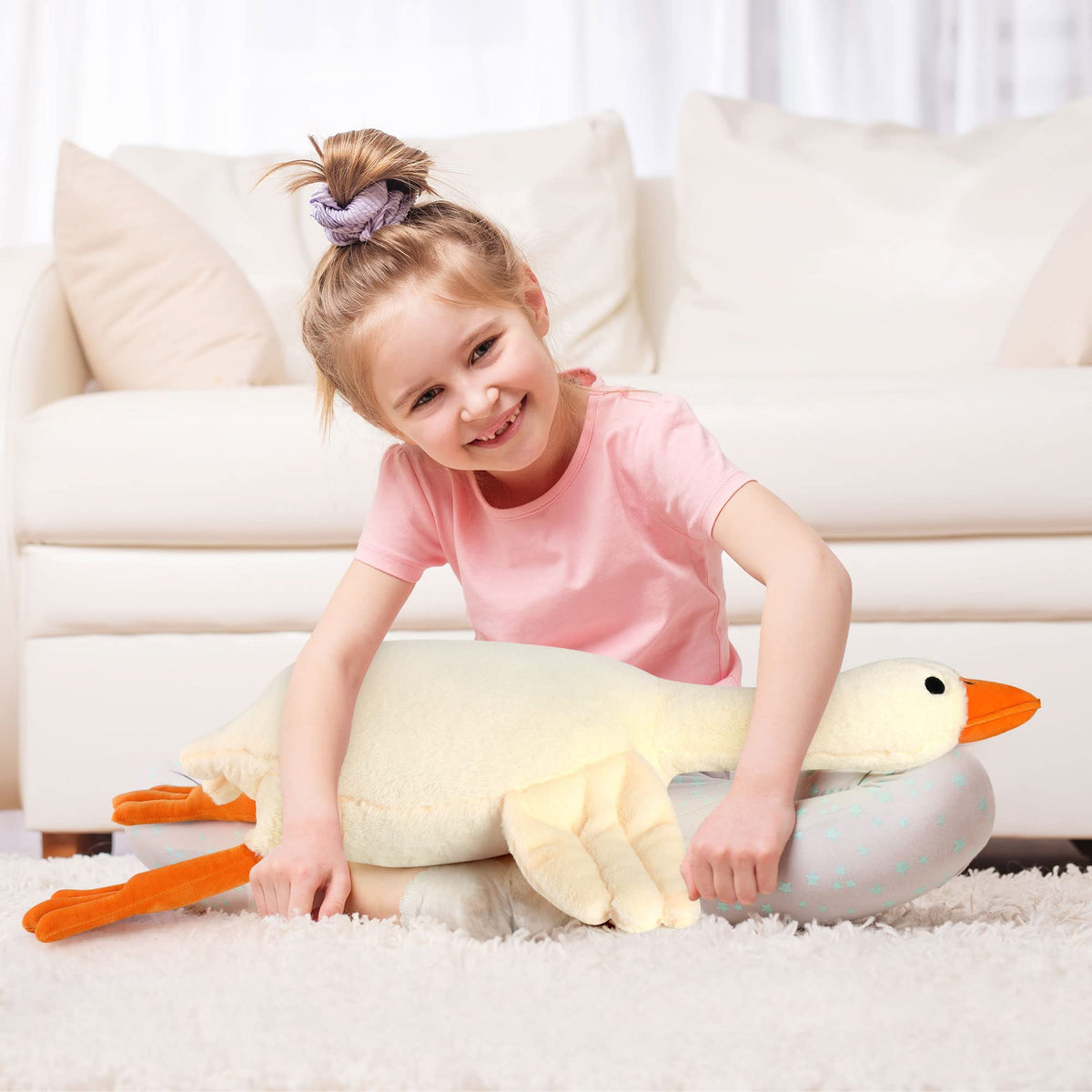 Qpewep goose plush pillow in use as cozy bedtime companion