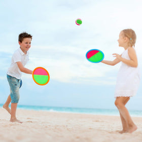 Qrooper toss-and-catch set showing four paddles and balls for family fun