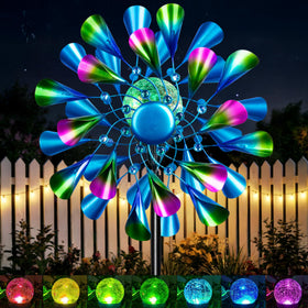 Qualdout Peacock Wind Spinner with colorful tail blades for vibrant daytime yard art and enhanced curb appeal.