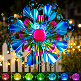 Qualdout Solar Wind Spinner Peacock adds moving color to outdoor spaces