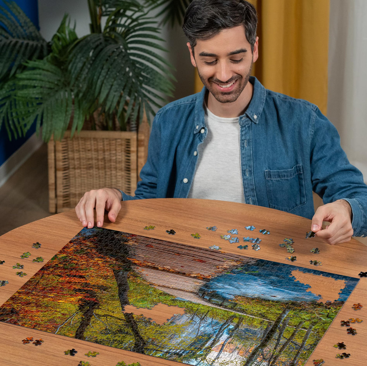 Ravensburger Autumnal Wooden Trail puzzle shows scenic mountain trail for immersive focus