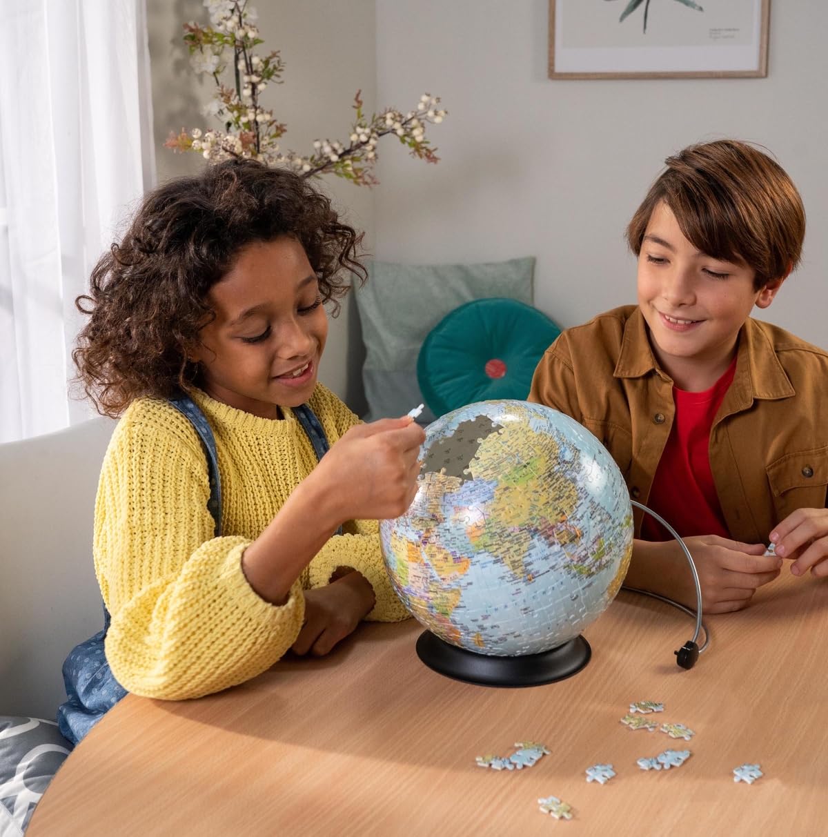 Completed Ravensburger Earth 3D puzzle ready for display as a globe model.