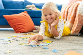 Ravensburger Gabby’s Dollhouse puzzle being solved by an excited child.