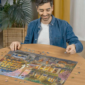 Ravensburger Paris at Dawn rosy sky over rooftops for soothing puzzle time.