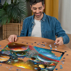 Ravensburger Planetary Vision puzzle in progress on a calm table.