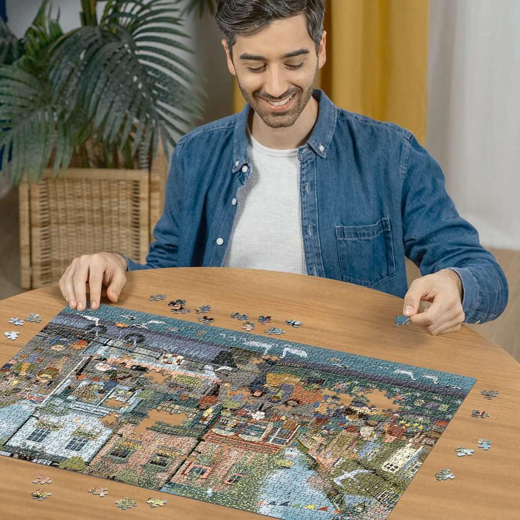 Ravensburger Riverside Town image focusing on reflections on water, great for conversation-starting framing.