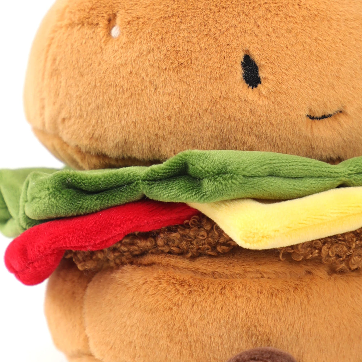RECUR hamburger stuffed animal soft material close-up emphasizes cozy feel.