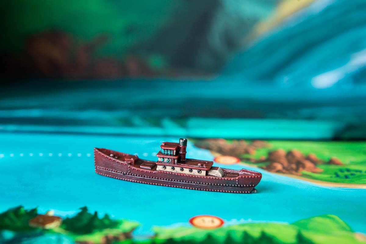 Solo captain navigating a calm sea and turning the page.