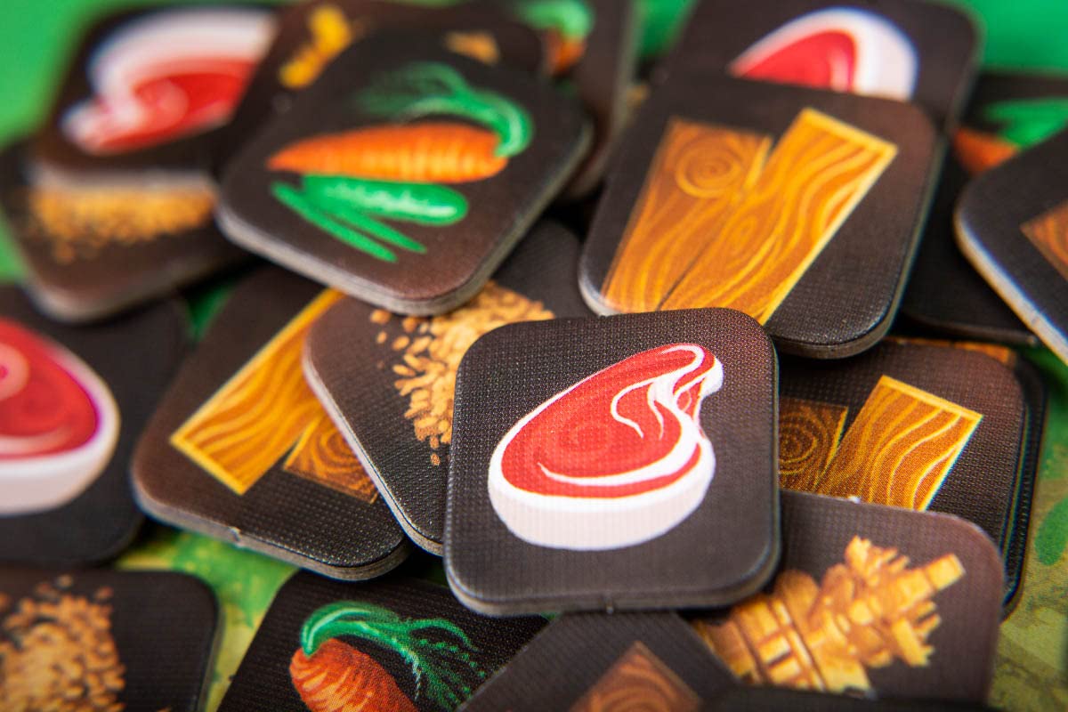 Close-up of totems and treasure icons across a detailed page spread.