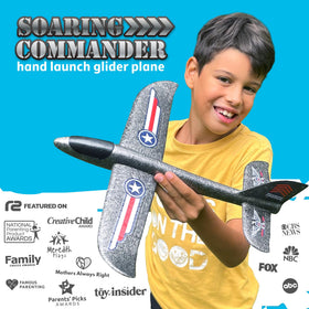 Soaring Commander foam airplane in hand shows safe, lightweight design for kids.