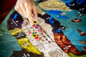 Renegade WWI 1914 players gathered around a table for a session.