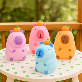 Rhode Island Novelty capybara toy hand-held close-up highlighting moldable sand texture for sensory play