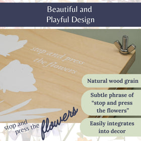 Eight-layer press in use demonstrates capacity to preserve multiple blooms at once.