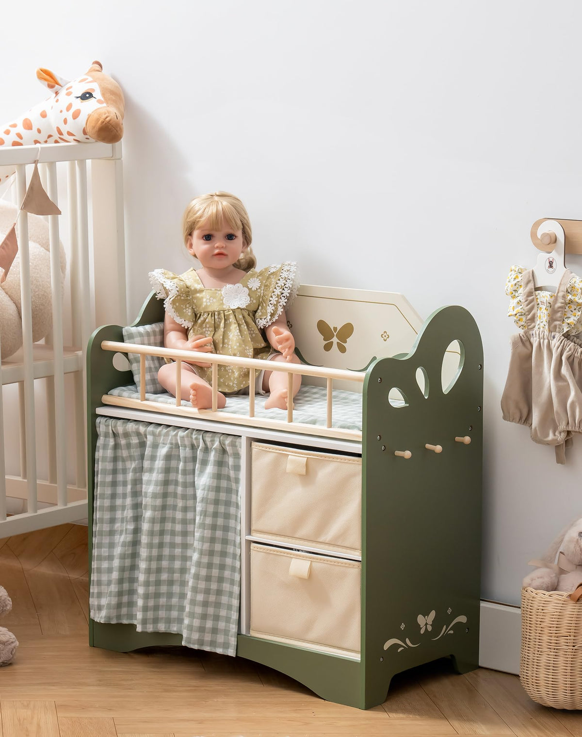 ROBOTIME doll crib with wooden hooks for accessories.
