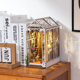 Robotime Garden House shows a cozy armchair and plant-filled shelves for calm reading spaces.