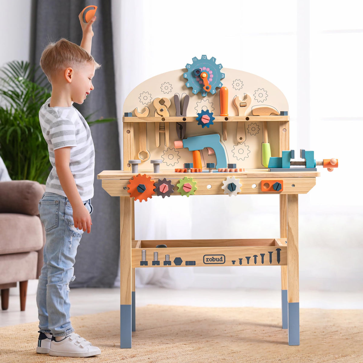 ROBUD kids role-playing at the workbench encourages cooperative play