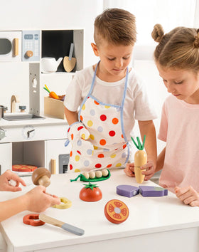 ROBUD wooden toy food set used by kids playing in a pretend kitchen for creative storytelling.