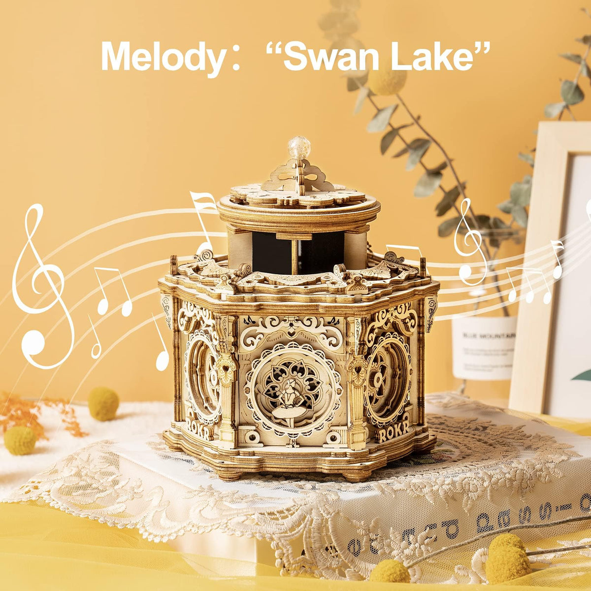 ROKR Secret Garden music box ballerina figurine enhances decorative appeal on a shelf.