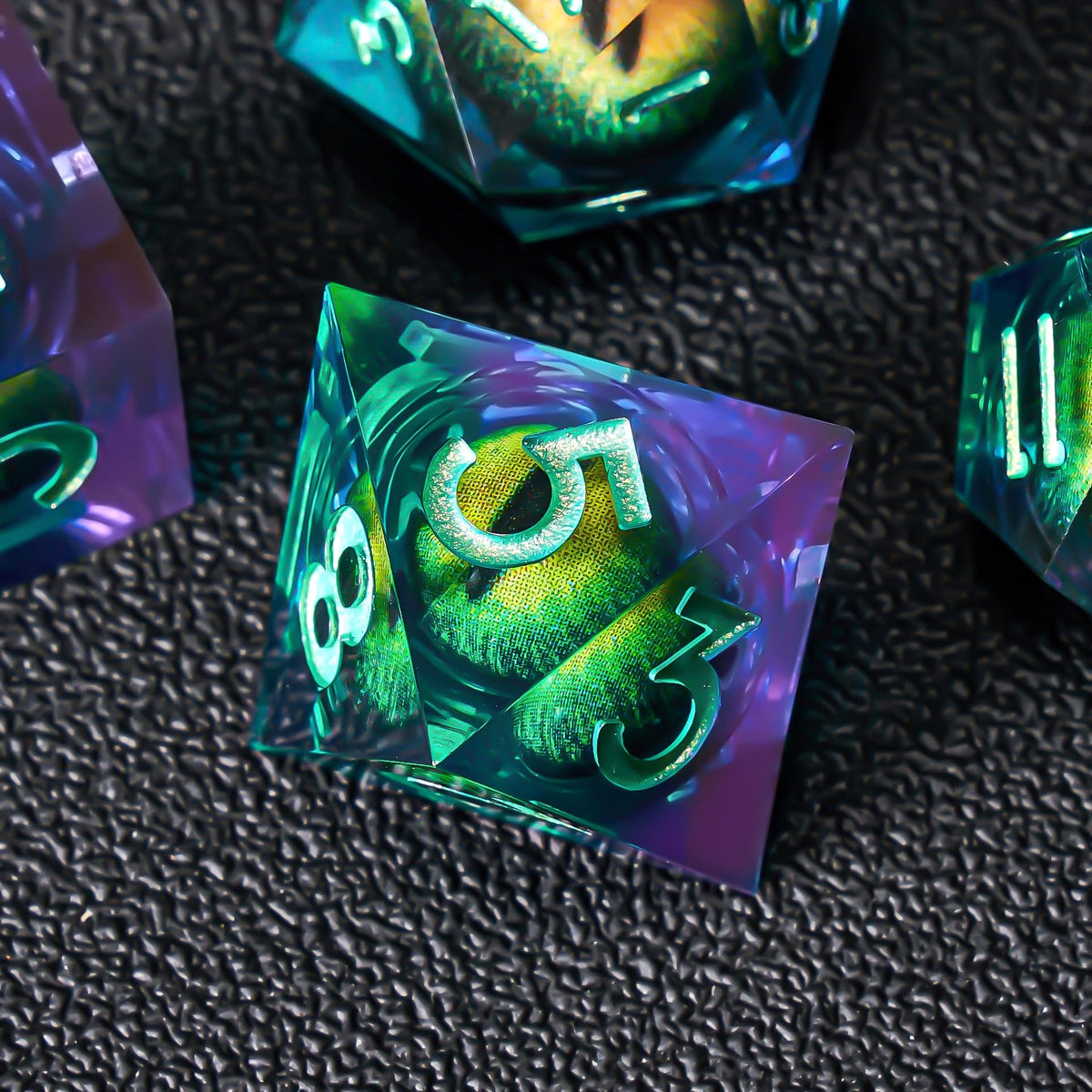 Role Dice cat eye liquid core close-up highlighting vibrant inner swirls.