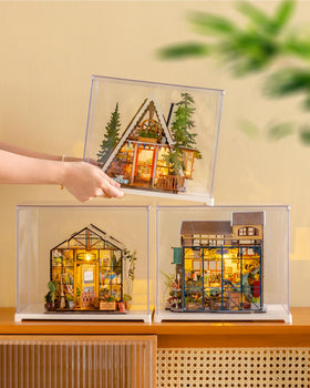 Rolife completed mini house on a bookshelf, decorative artwork.