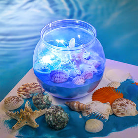 RoundFunny beach-themed centerpieces featuring twelve bowls and shells for coastal ambiance.