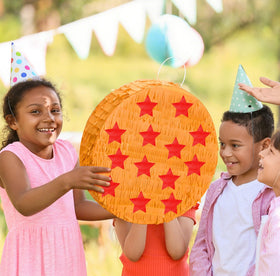 RoundFunny yellow red pinata adds colorful centerpiece.