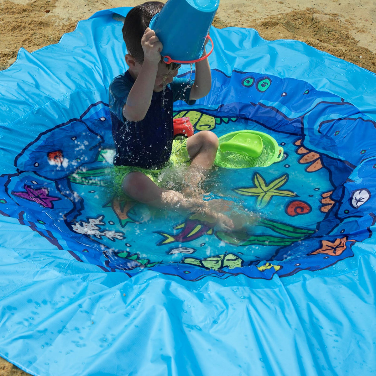 Corner sand pockets stabilize the mat and store small toys