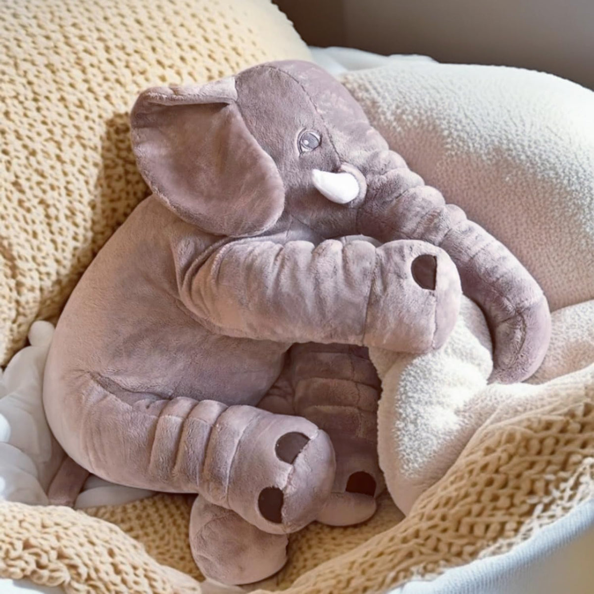 Ryttir 24-inch elephant snuggle pose, plush toy great for cuddling.