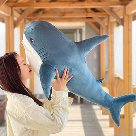 Ryttir giant body pillow supports relaxed lounging and reading.