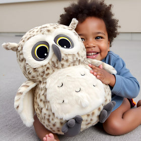 Ryttir Snowy Owl plush face close-up with citrine eyes.