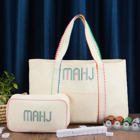Sadnyy embroidered mahjong canvas tote; refined design plus durable construction.