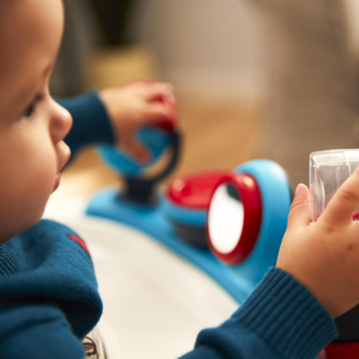 Safety 1st Ready, Set, Walk! DX teal walker supports early steps and exploration.
