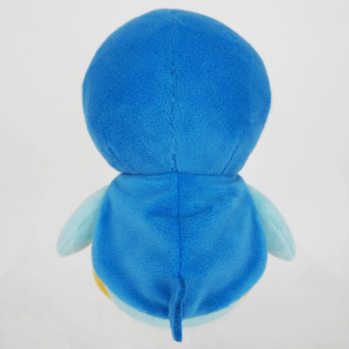 Sanei Piplup plush cape-detail close-up emphasizes its cute crown marking.