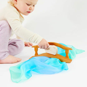 Sarah's Silks Blossom worn as cape for imaginative storytelling and movement.