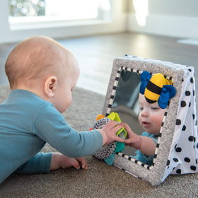 Sassy mirror supports self-awareness and early fine motor exploration.