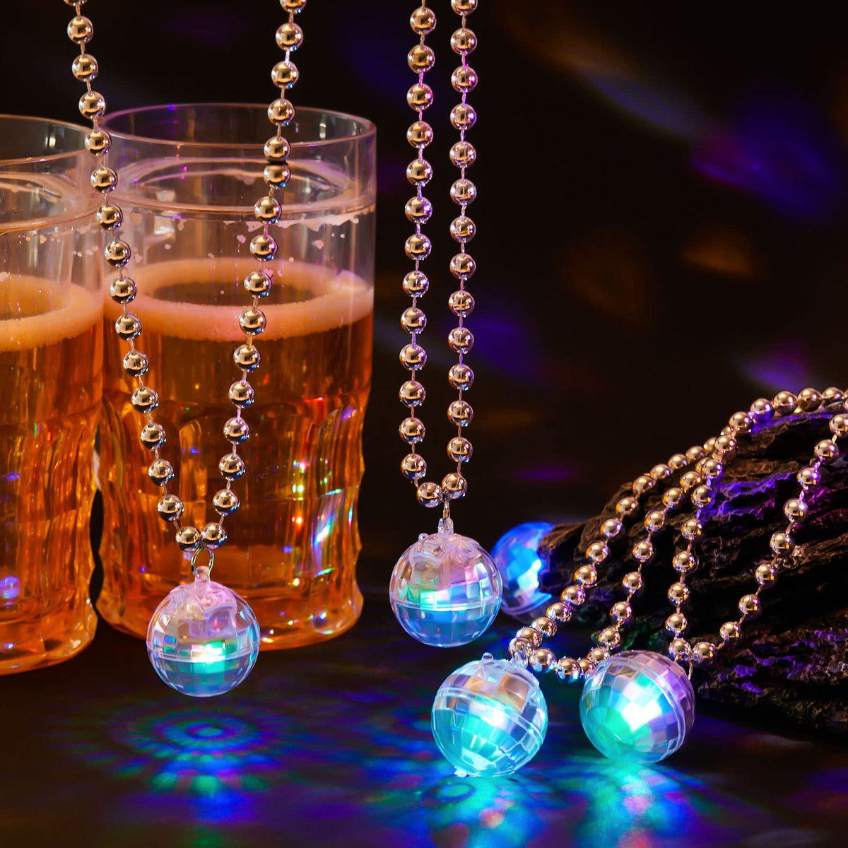 Sasylvia disco ball necklace close-up showing vibrant glow.